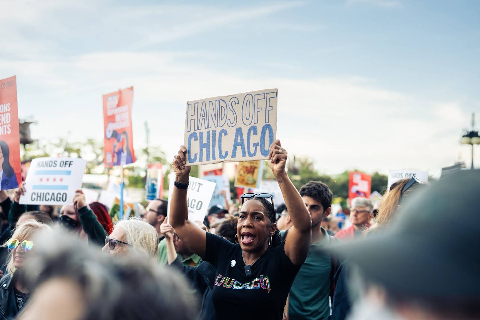 Juliana holding her poster at the protest